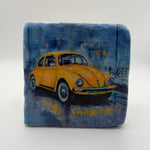 Vintage Volkswagen Beetle artwork printed on square travertine stone coaster