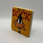 Comedic quote 'What The Duck' printed on square travertine stone coaster