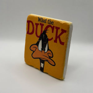 Comedic quote 'What The Duck' printed on square travertine stone coaster