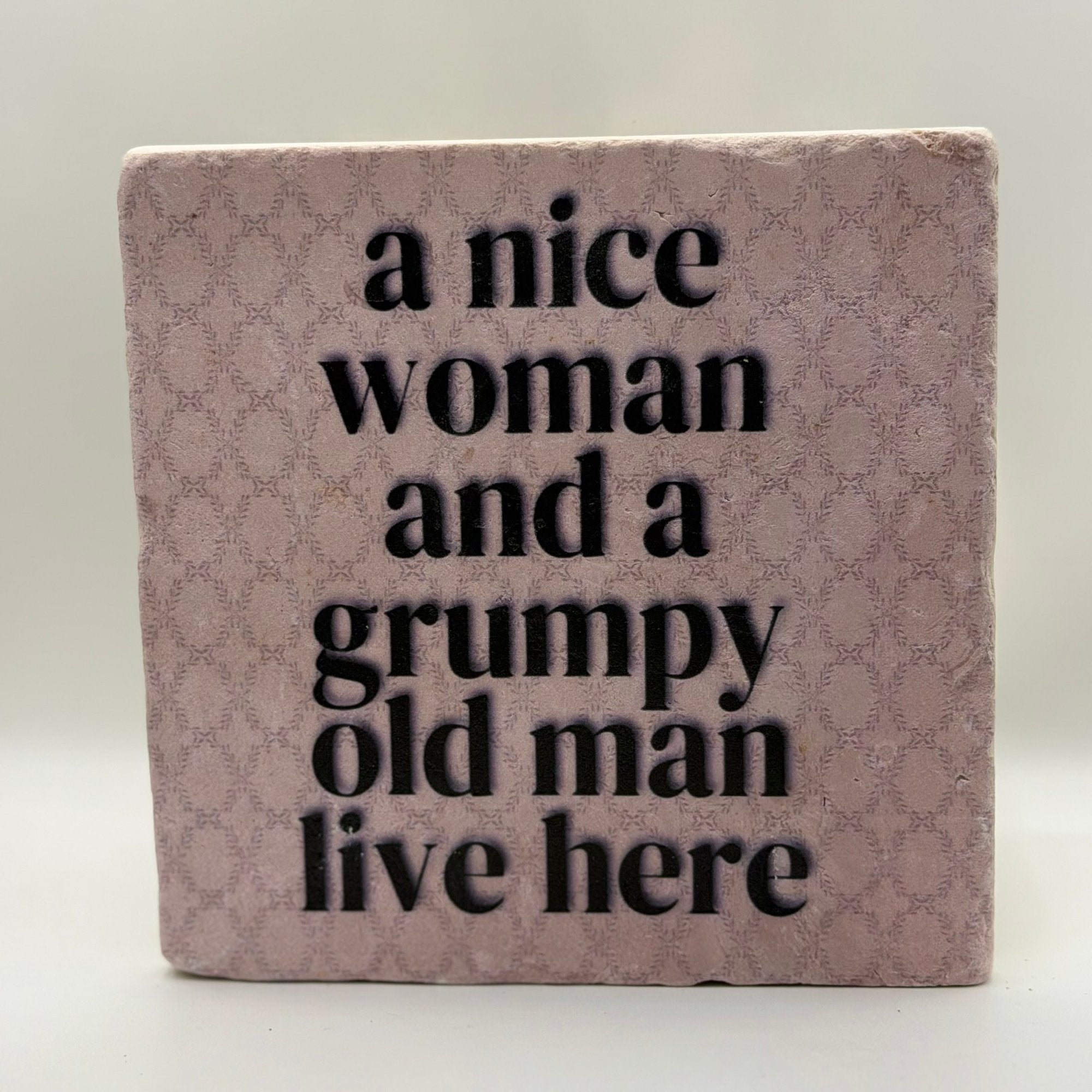 A Nice Woman And A Grumpy Old Man Live Here Natural Travertine Stone Hotpad artwork
