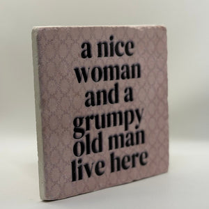 A Nice Woman And A Grumpy Old Man Live Here Natural Travertine Stone Hotpad artwork