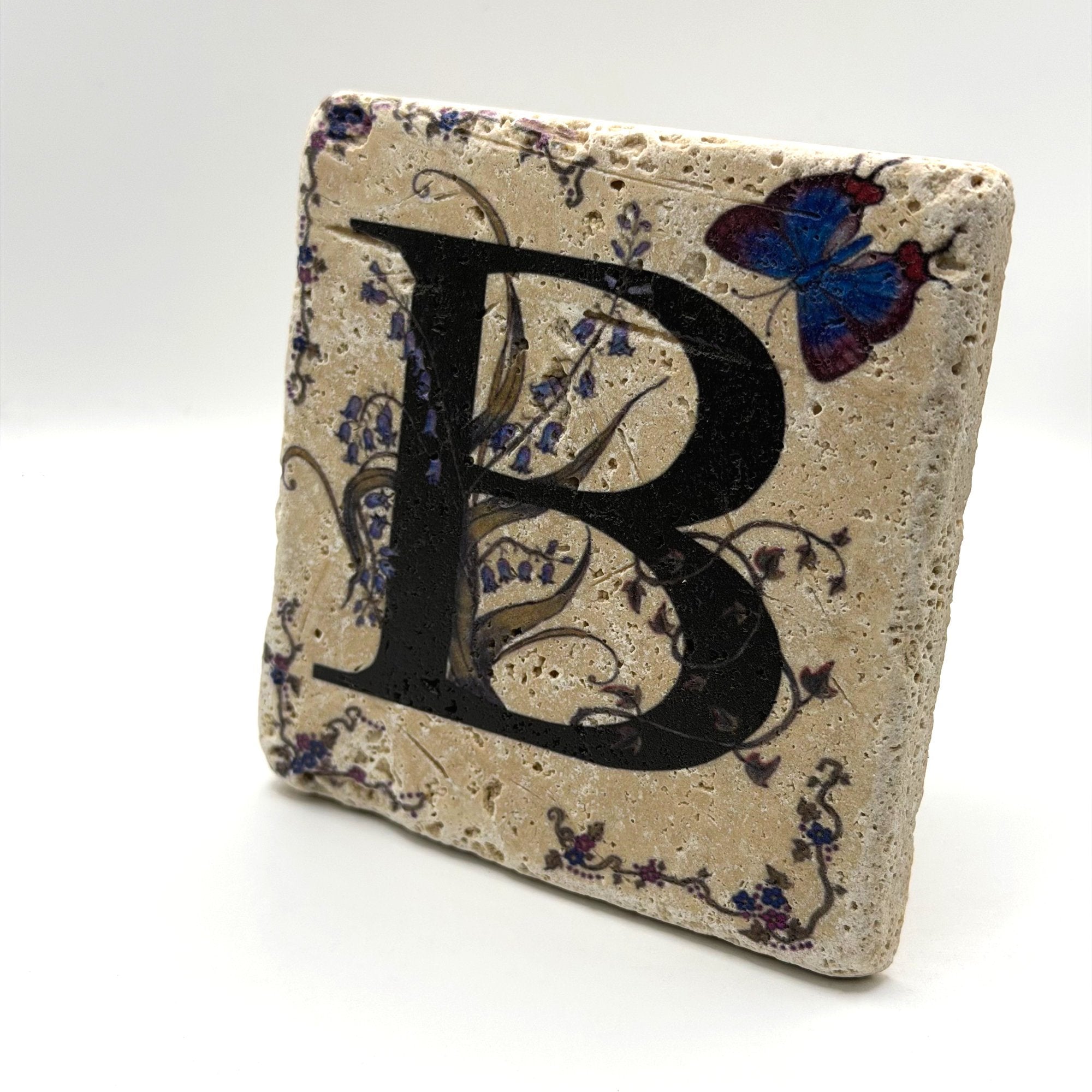 Alphabet letter B design printed on a natural stone coaster