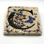 Alphabet letter C design printed on a natural stone coaster