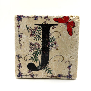 Alphabet letter J design printed on a natural stone coaster