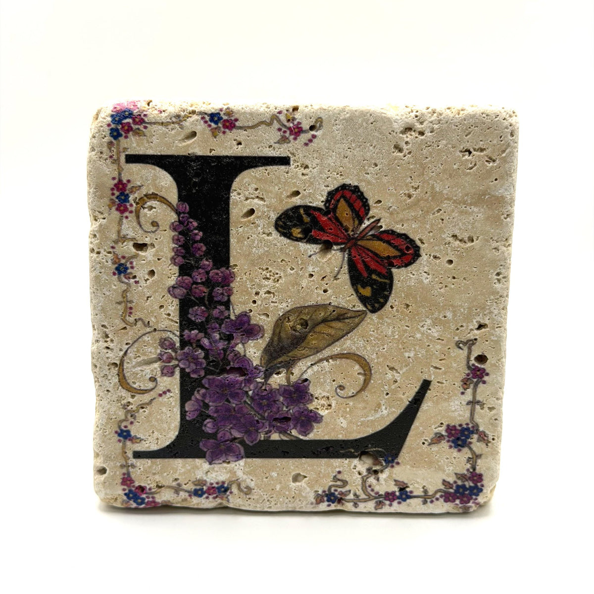 Alphabet letter L design printed on a natural stone coaster