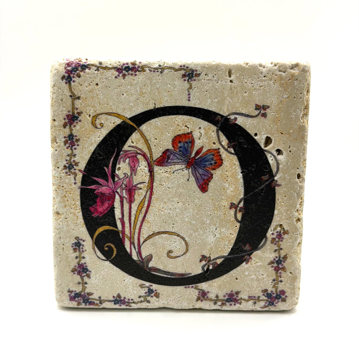 Alphabet letter O design printed on a natural stone coaster