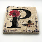 Alphabet letter P design printed on a natural stone coaster