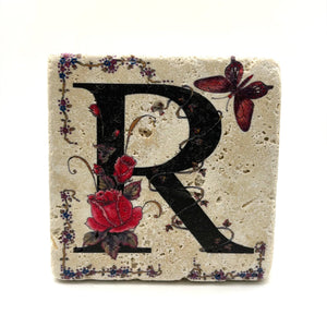 Alphabet letter R design printed on a natural stone coaster