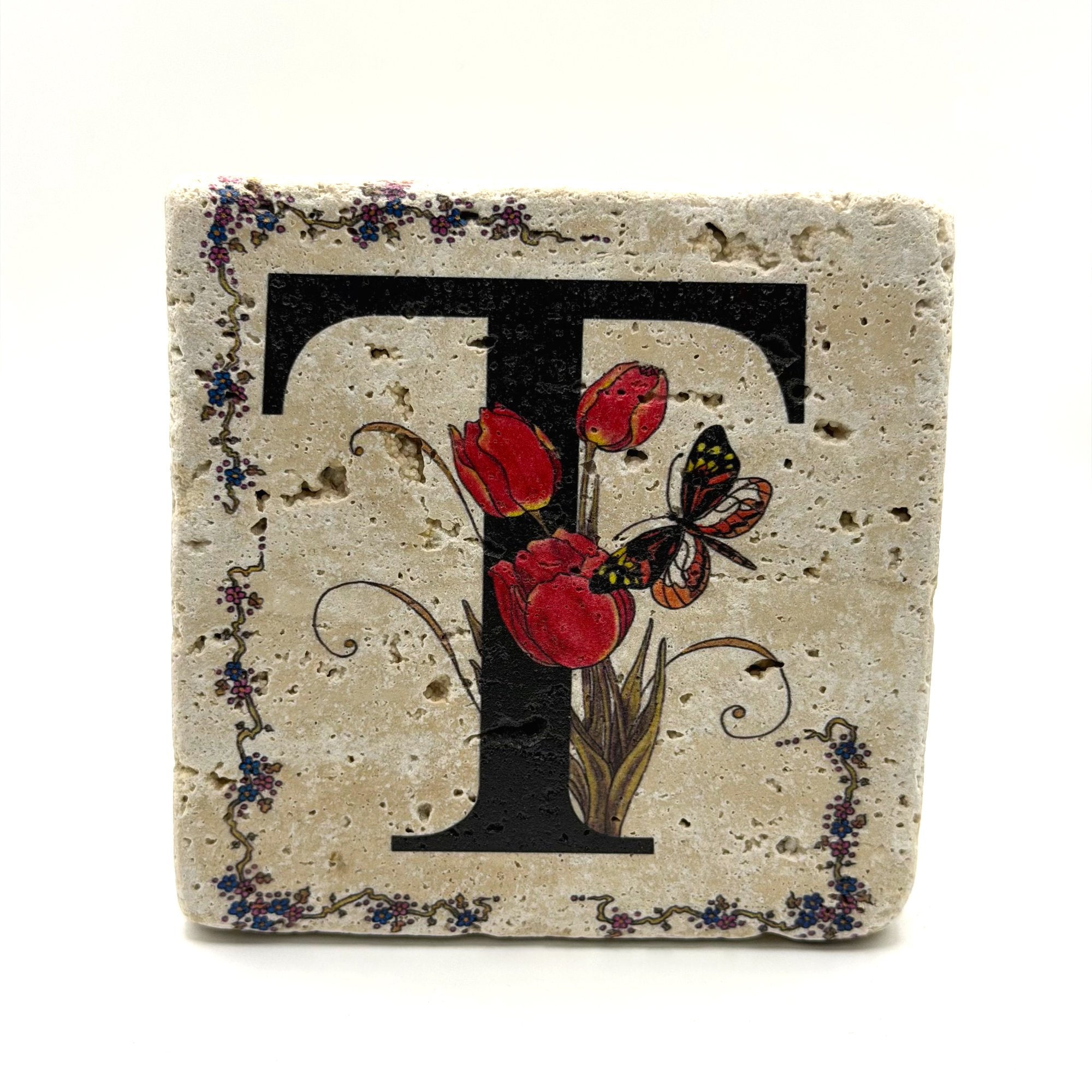 Alphabet letter T design printed on a natural stone coaster