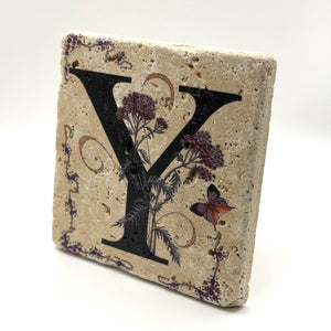 Alphabet letter Y design printed on a natural stone coaster