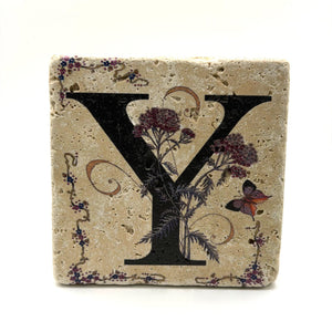 Alphabet letter Y design printed on a natural stone coaster