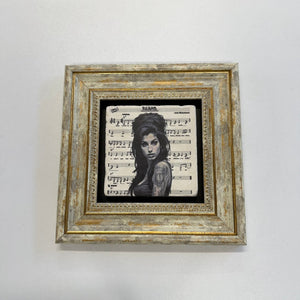 Variant Mapping v4 | amy-winehouse-natural-travertine-stone-coaster | with Gold Frame | sha256:c0efd0b6b079