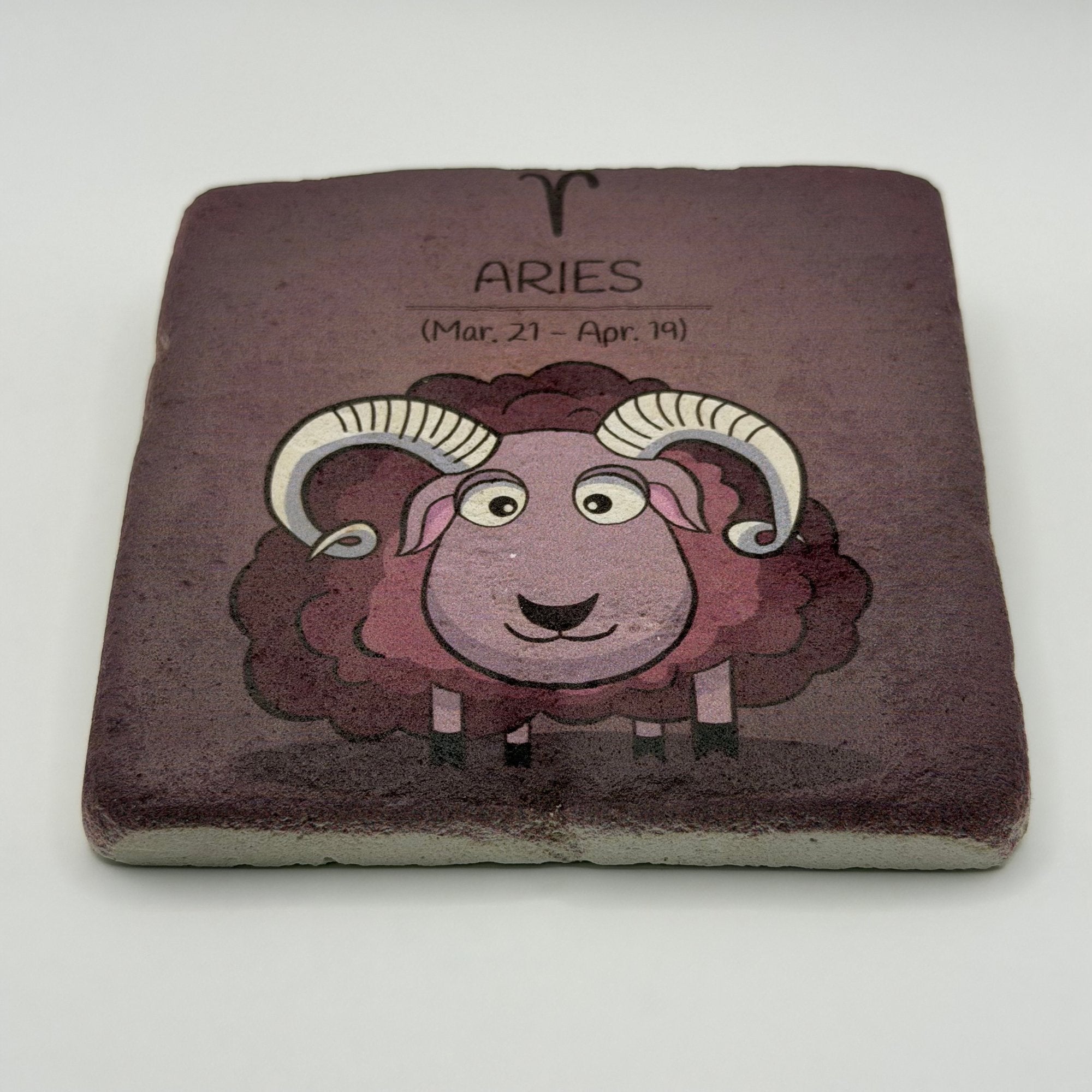 Aries zodiac symbol printed on square travertine stone coaster