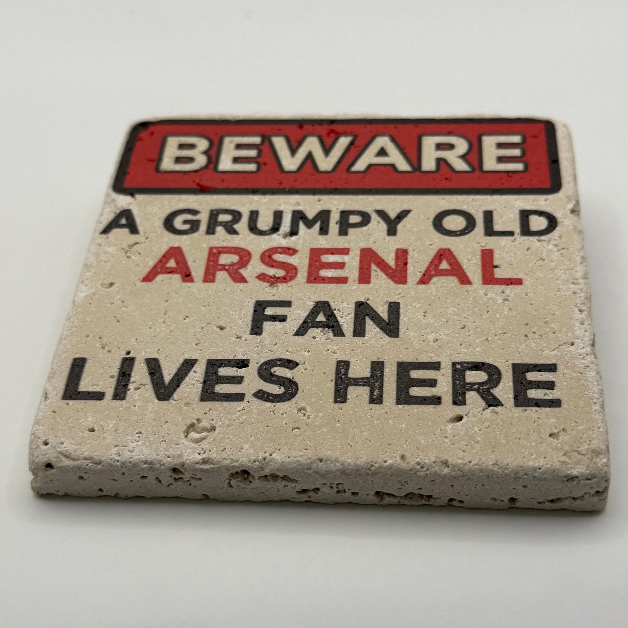 Arsenal FC logo and warning text printed on square travertine stone coaster