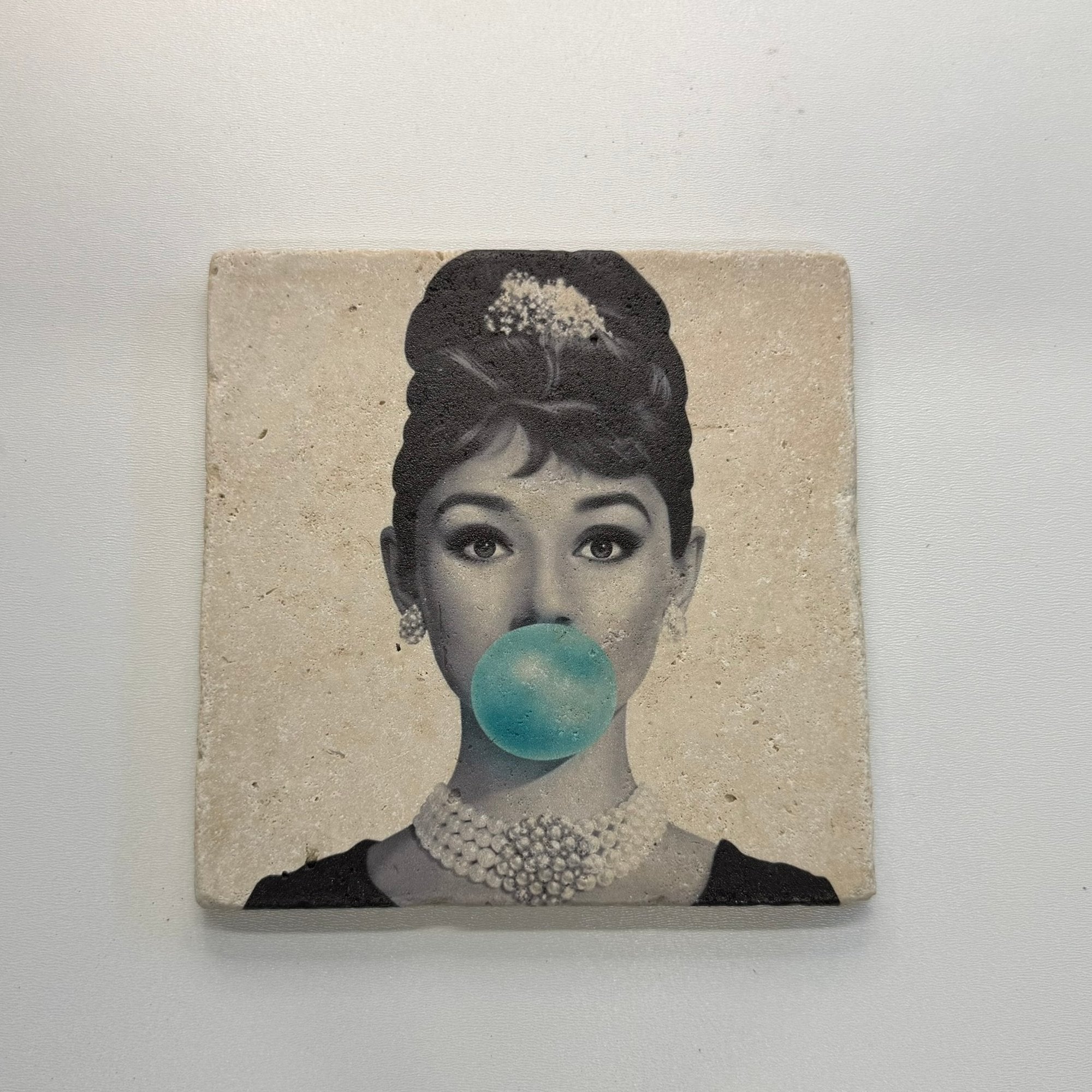 Audrey Hepburn Blue Bubble Natural Travertine Stone Hotpad artwork