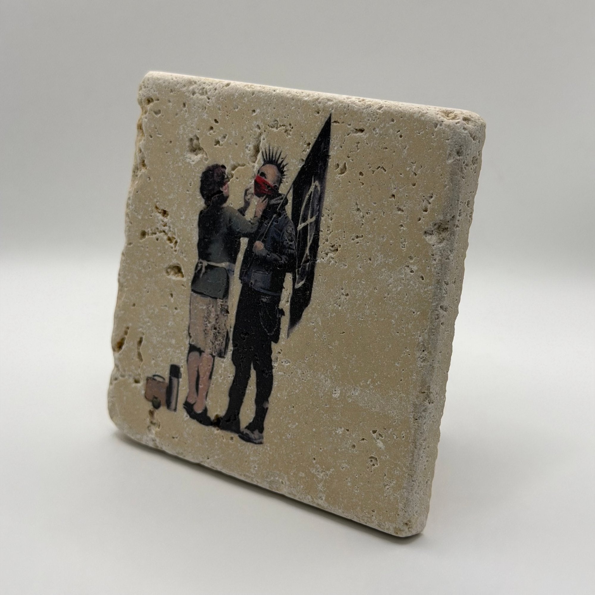 Banksy's Anarchist artwork printed on square travertine stone coaster