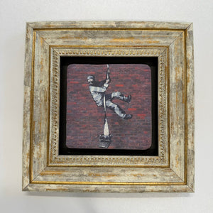 Variant Mapping v4 | banksy-create-escape-natural-stone-coaster | with Gold Frame | sha256:24bfa1ab67eb