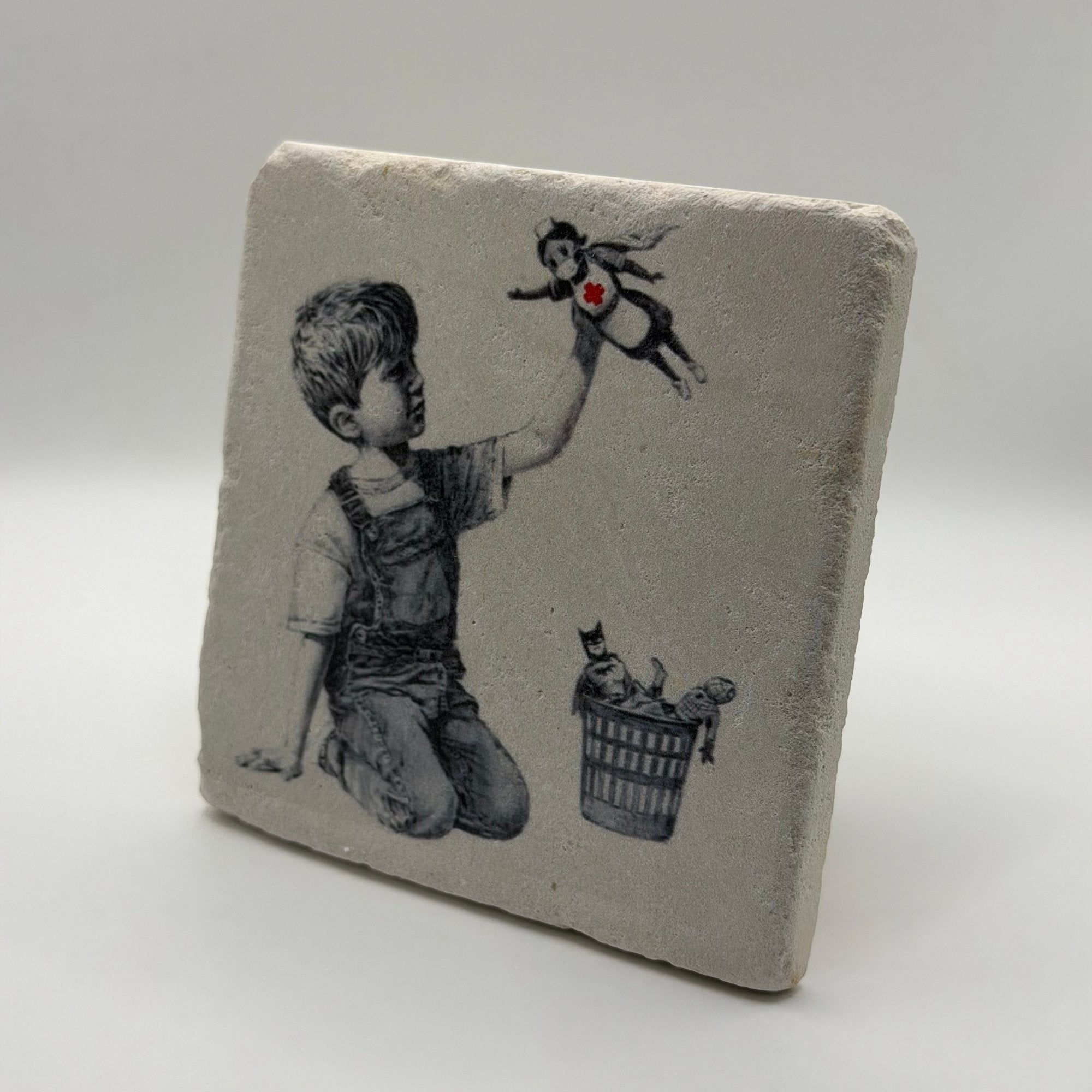 Banksy artwork featuring 'Game Changer' nurse printed on square travertine stone coaster