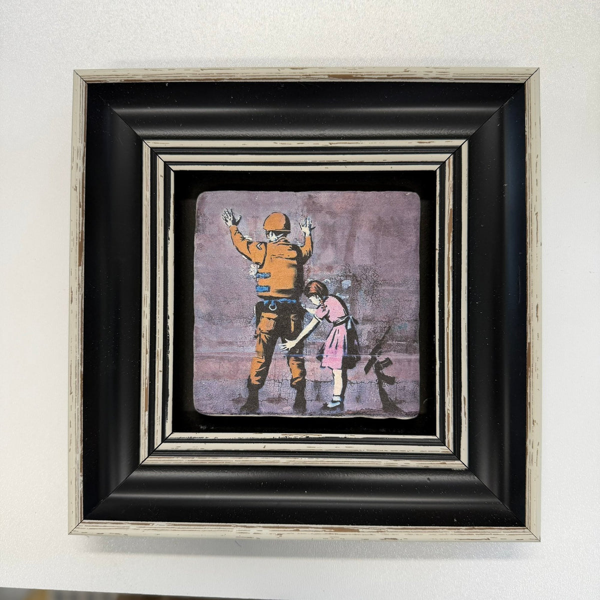 Variant Mapping v4 | banksy-girl-frisking-soldier-natural-stone-coaster | with Black Frame | sha256:ac04d628add8