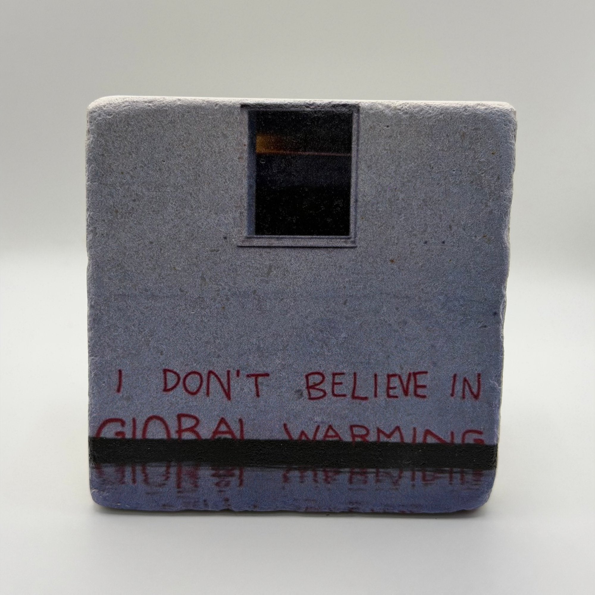 Banksy-style artwork featuring global warming awareness printed on square travertine stone coaster