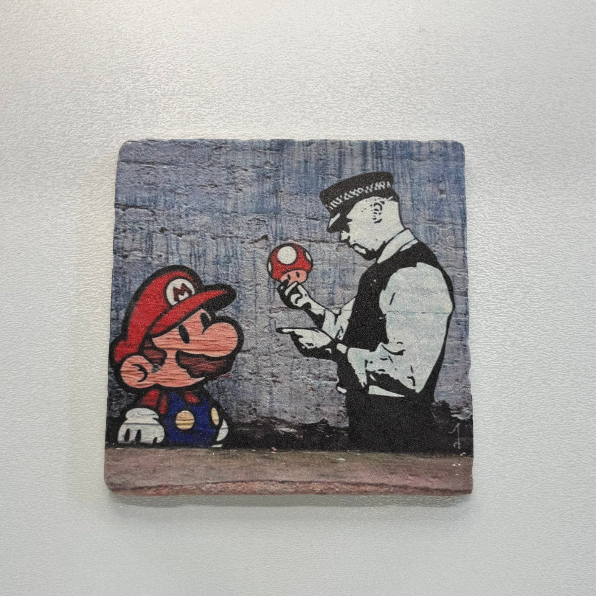 Banksy Mario And Cop Street Art Natural Travertine Stone Hotpad artwork