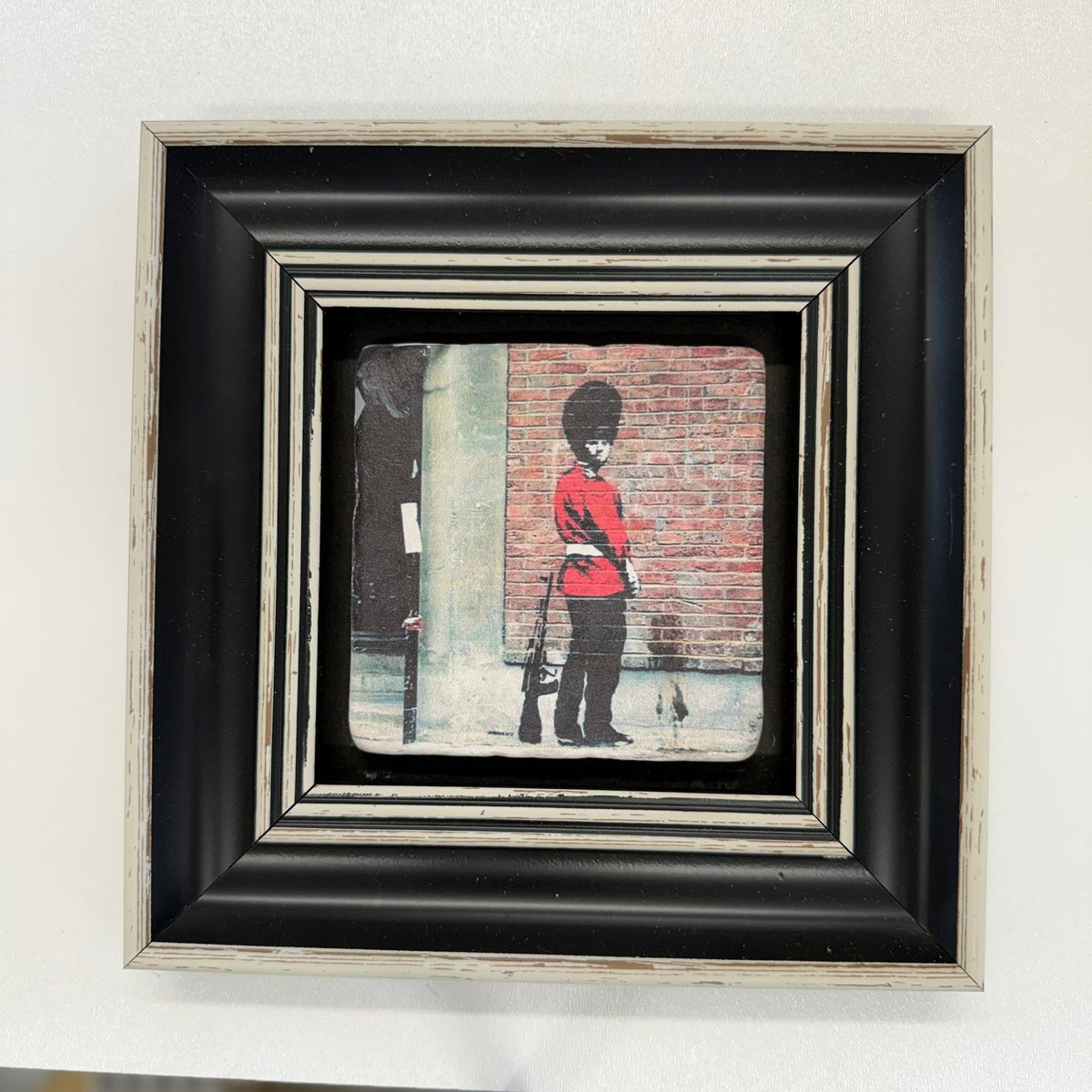 Variant Mapping v4 | banksy-pissing-guard-natural-stone-coaster | with Black Frame | sha256:2535336d2766
