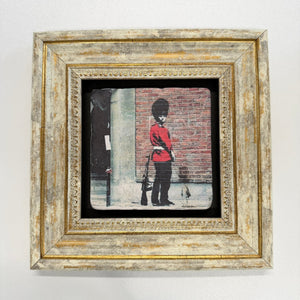 Variant Mapping v4 | banksy-pissing-guard-natural-stone-coaster | with Gold Frame | sha256:2cf9273b4d83