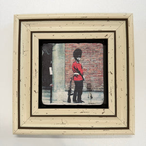 Variant Mapping v4 | banksy-pissing-guard-natural-stone-coaster | with White Frame | sha256:43db631e49cf