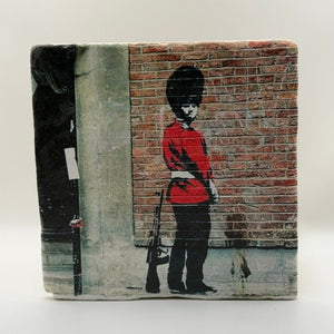 Banksy Pissing Guard Street Art Natural Travertine Stone Hotpad artwork