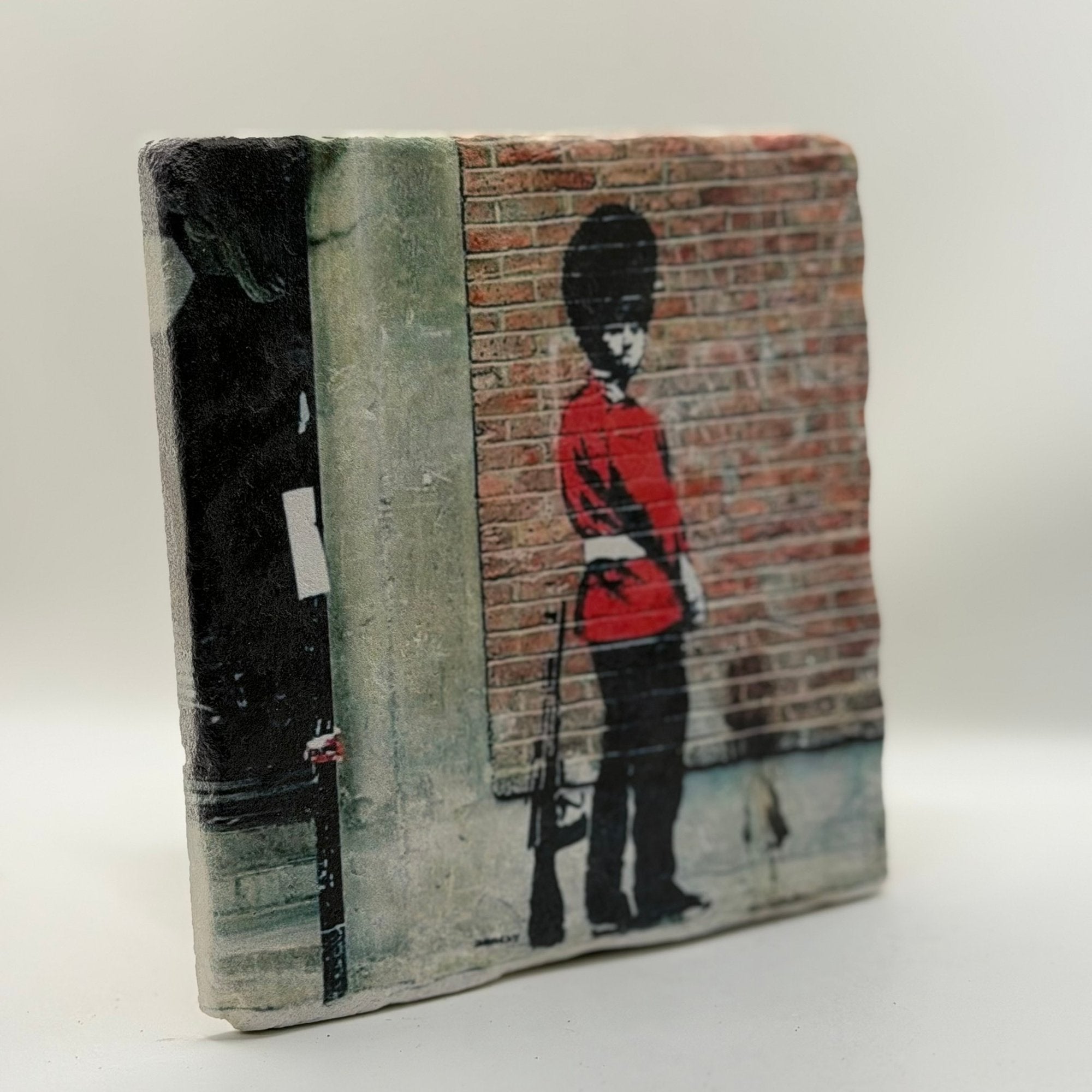Banksy Pissing Guard Street Art Natural Travertine Stone Hotpad artwork