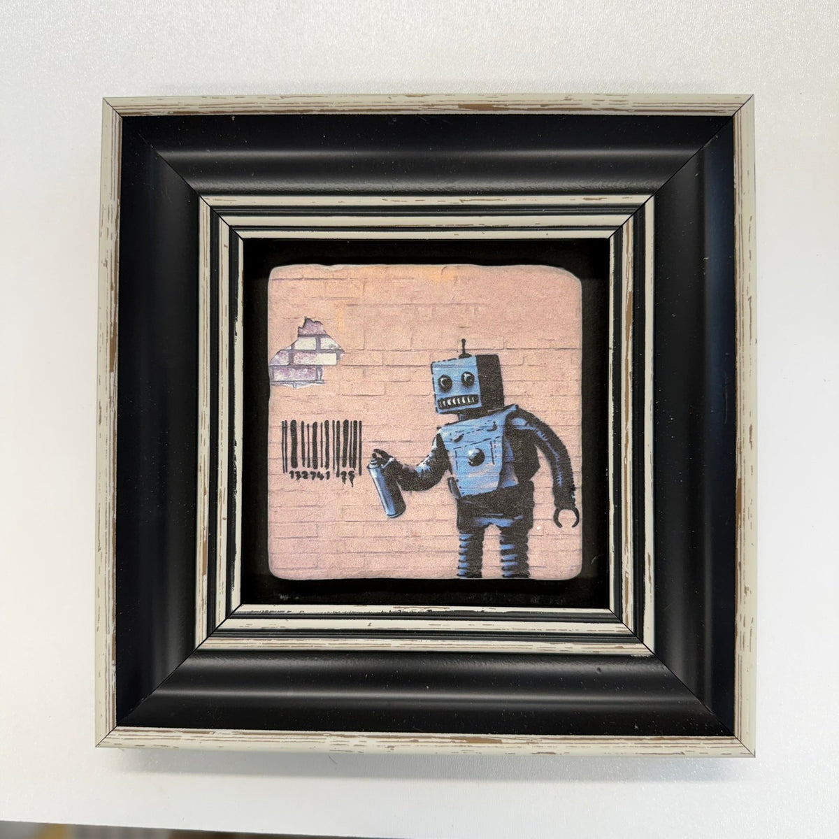 Variant Mapping v4 | banksy-robot-natural-stone-coaster | with Black Frame | sha256:f27df2ebb7a7