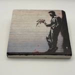 Banksy's iconic artwork 'Waiting In Vain' printed on square travertine stone coaster