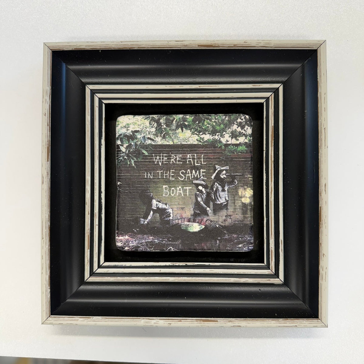 Variant Mapping v4 | banksy-we-re-all-human-stone-coaster | with Black Frame | sha256:3ea9bb8a03ed