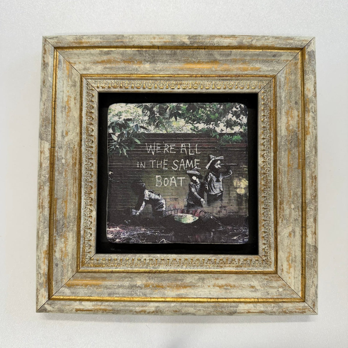 Variant Mapping v4 | banksy-we-re-all-human-stone-coaster | with Gold Frame | sha256:9d10d633f4ef