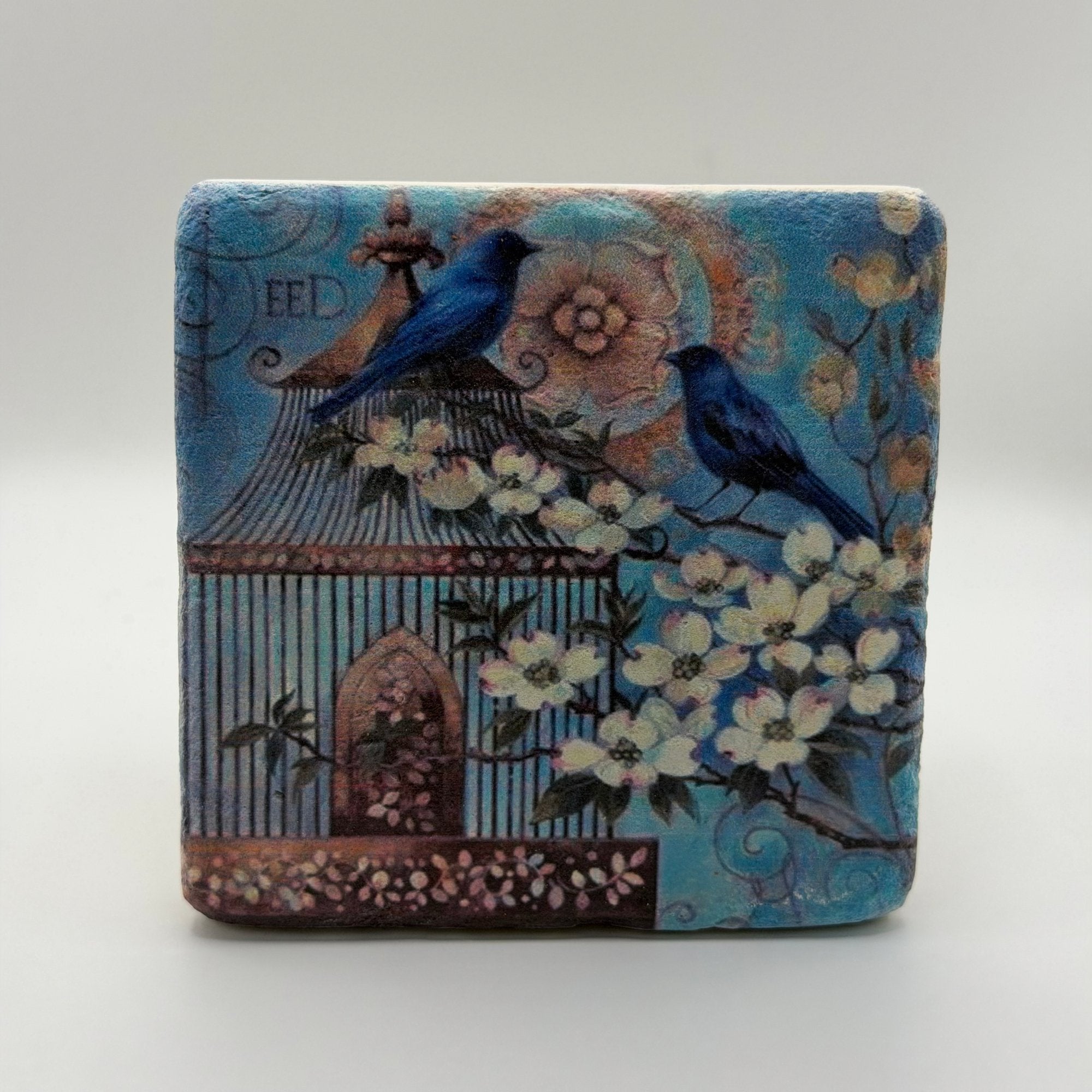 Delicate bird and flower artwork printed on square travertine stone coaster