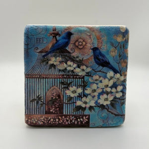 Delicate bird and flower artwork printed on square travertine stone coaster