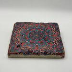 Bohemian-inspired tribal design printed on square travertine stone coaster