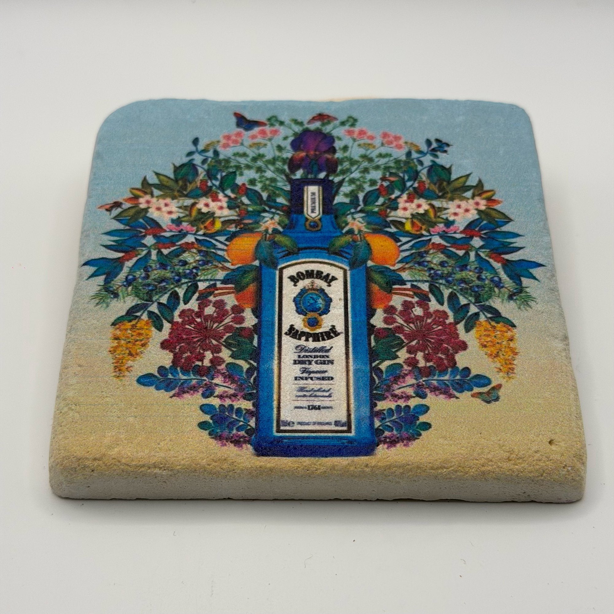 Bombay Sapphire logo printed on square natural travertine stone coaster