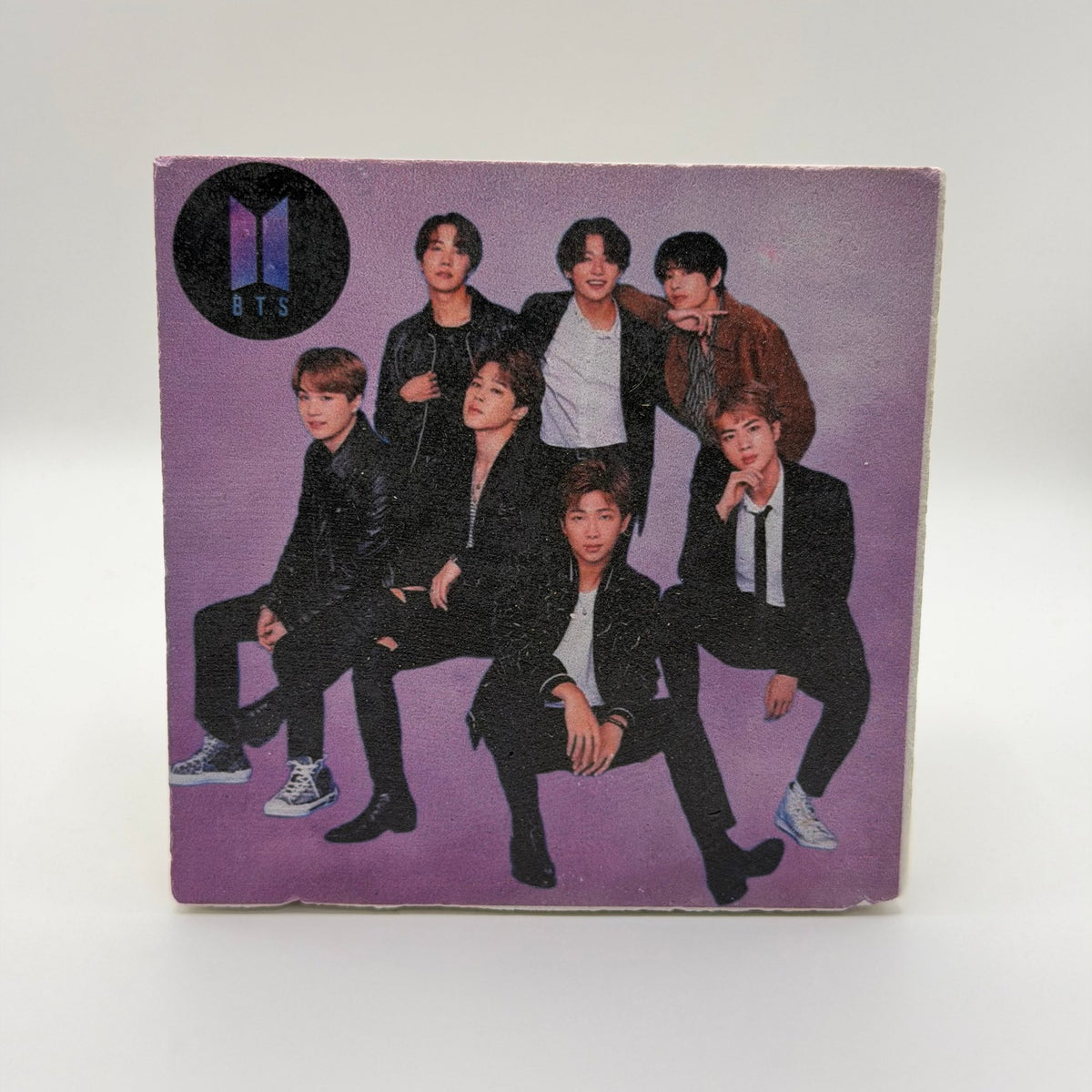 BTS artwork printed on square travertine stone coaster