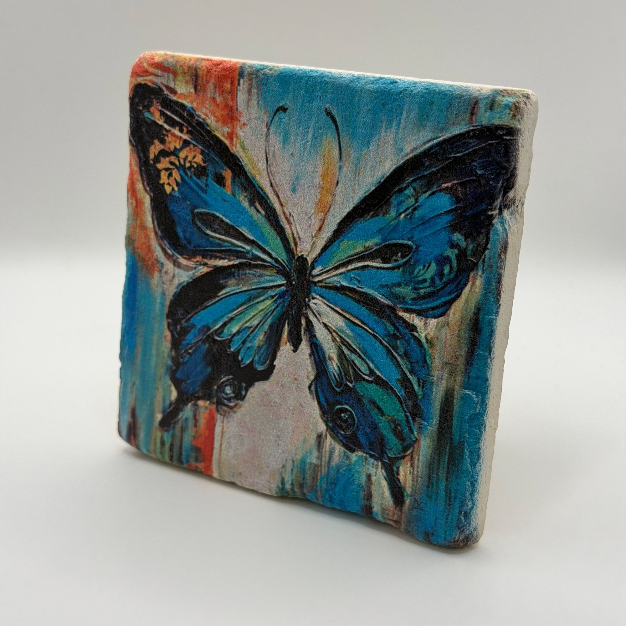 Colorful butterfly artwork printed on square travertine stone coaster