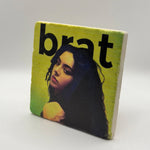 Charli XCX artwork printed on square travertine stone coaster