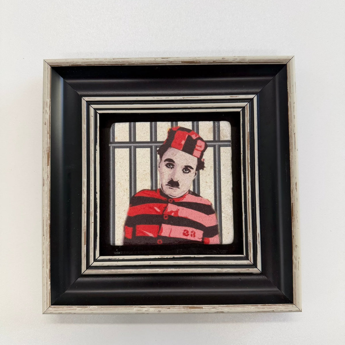 Variant Mapping v4 | charlie-chaplin-as-the-little-tramp-natural-stone-coaster | with Black Frame | sha256:2c80aa3e2c03