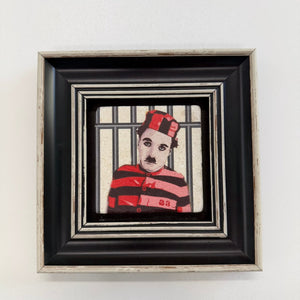 Variant Mapping v4 | charlie-chaplin-as-the-little-tramp-natural-stone-coaster | with Black Frame | sha256:2c80aa3e2c03