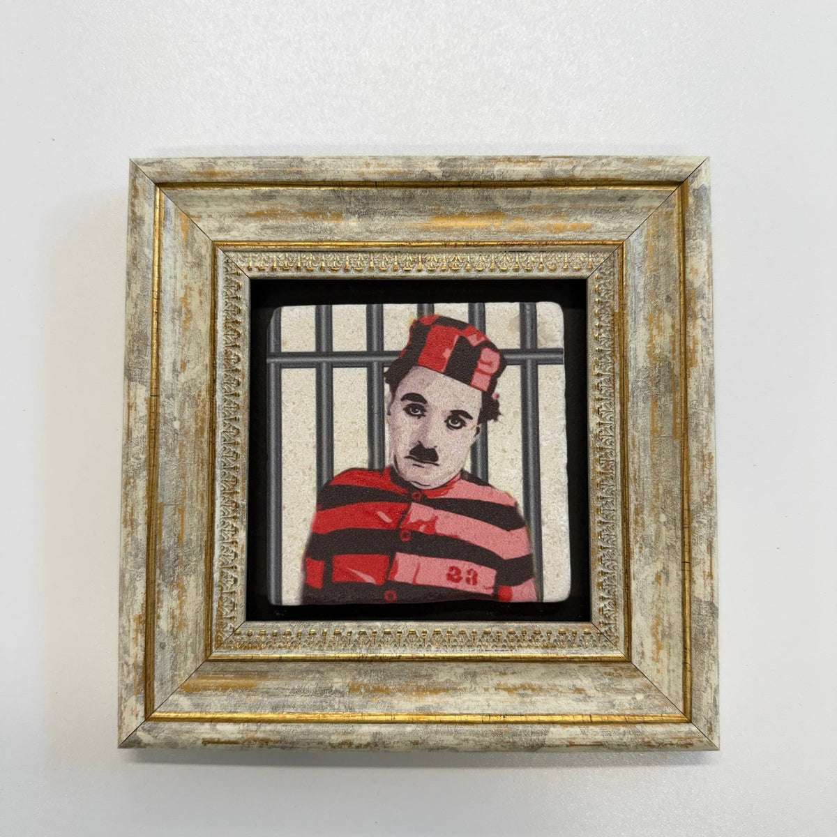 Variant Mapping v4 | charlie-chaplin-as-the-little-tramp-natural-stone-coaster | with Gold Frame | sha256:471868ab4d44