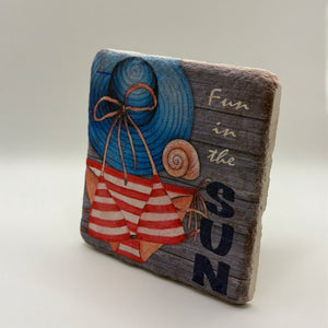 Coastal beach scene printed on square travertine stone coaster