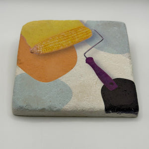 Vintage-inspired illustration of corn on square travertine stone coaster