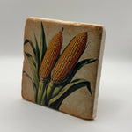 Retro illustration of a corn cob printed on square travertine stone coaster