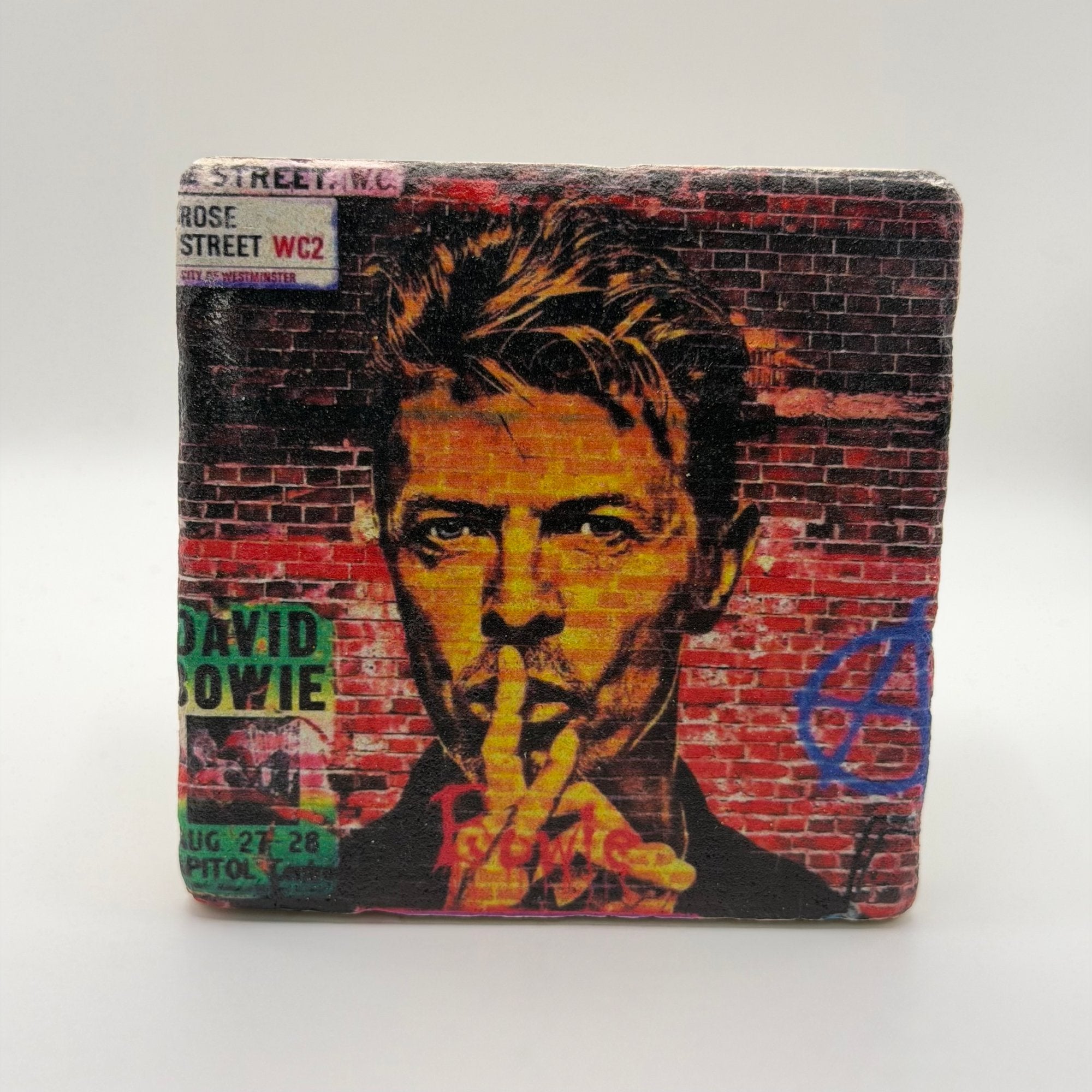 Graffiti artwork inspired by David Bowie printed on square travertine stone coaster
