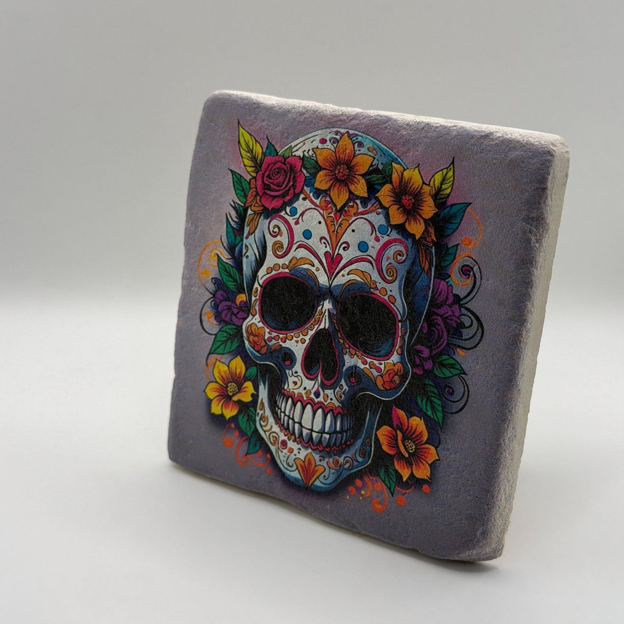 Dia De Los Muertos inspired artwork printed on square travertine stone coaster