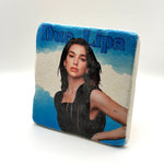 Dua Lipa artwork printed on square travertine stone coaster